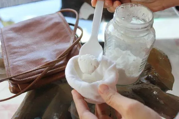 Stuffing newspaper into shoes absorbs moisture safely; blowing hot air with a hair dryer is what to avoid
