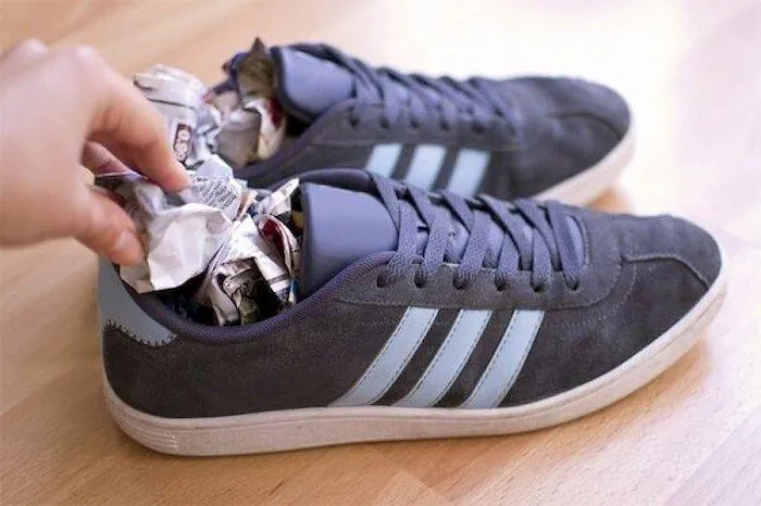 Applying specialty sole adhesive to a football boot sole
