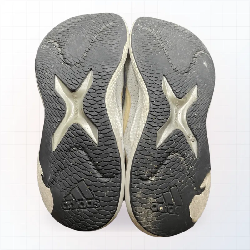 Adidas with worn sole — Standard sole capping (before)